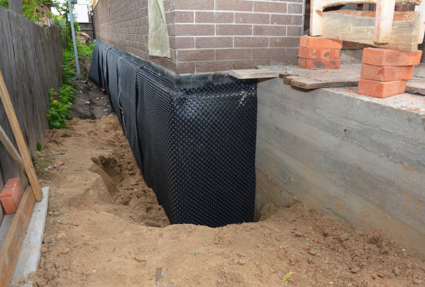 Happy homeowners after waterproofing job in Green Valley